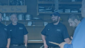 Vaughan Comfort Services HVAC technicians and plumbers holding a meeting at office in Magnolia, NJ.